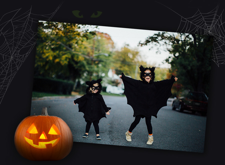 Two children dressed as bats for Halloween 2