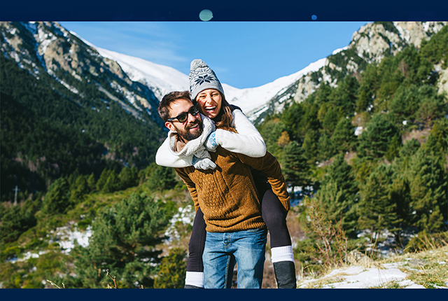 Couple enjoying mountain sun Mobile